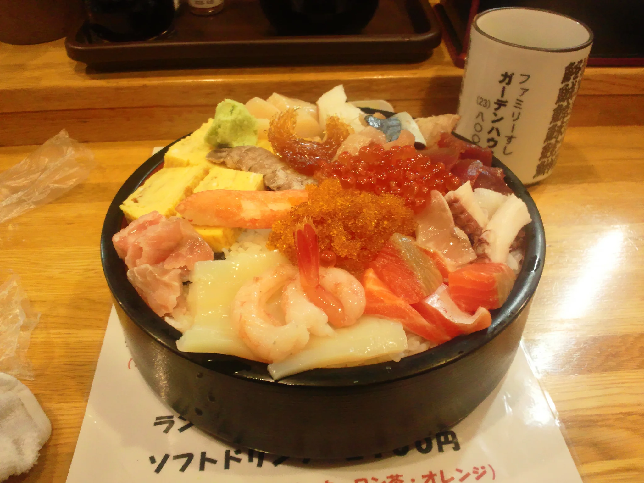Overflowing Hokkaido kaisendon rice bowl brimming with sweet sea urchin, king crab, and glistening salmon roe