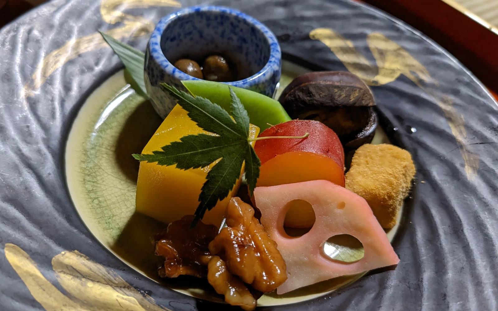 Traditional Zen monastic Shojin Ryori vegetarian meal served in vermilion lacquer nesting bowls